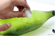 Use ice to cut glass How to Make a Chandelier from Old Wine Bottles Step 2 Ice Cut