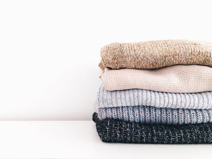 sweater stack of clothes